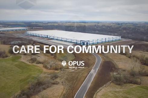 aerial view of an industrial building with the words "Care for Community" and "Opus" in foreground