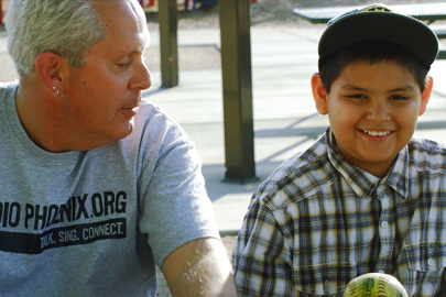 close-up view of a man and boy outside