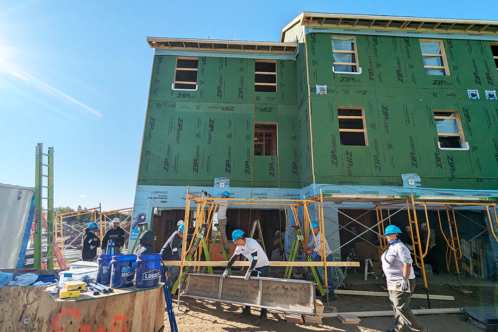 the exterior of an under construction town house showing two units