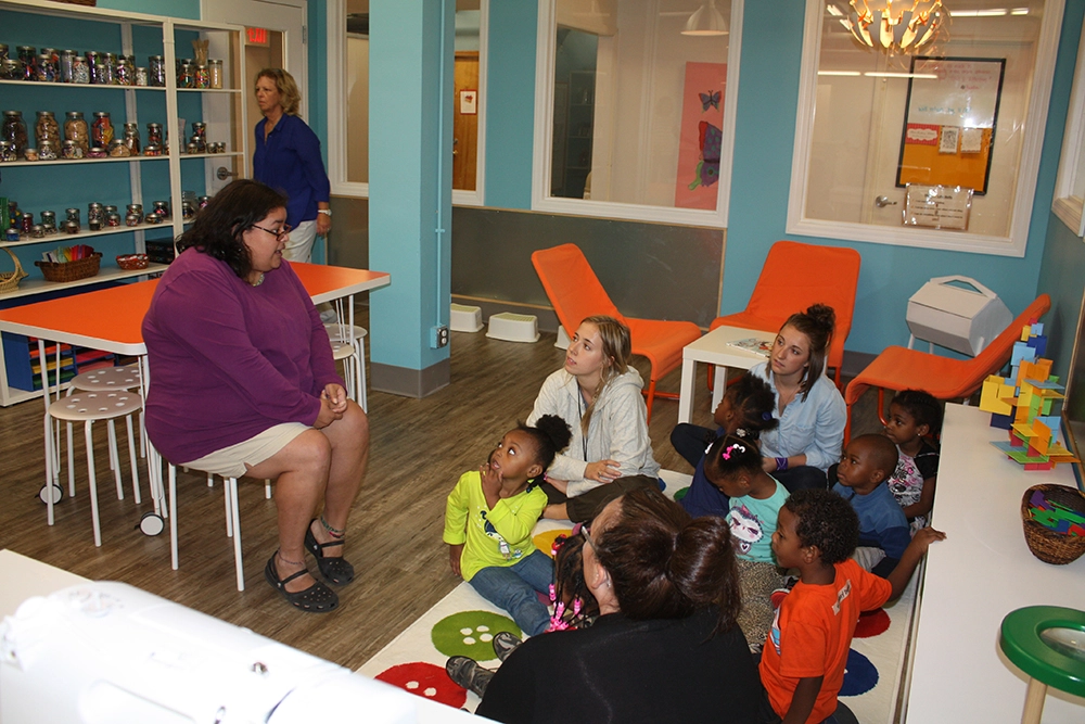 woman teaching young children in classroom