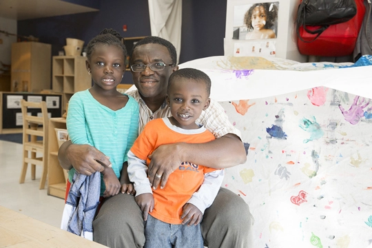 Christopher House man with children