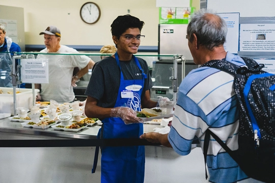 men serving food