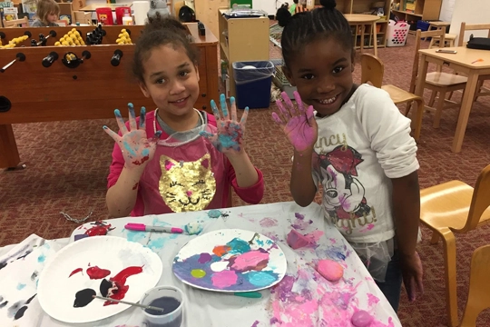 two girls with paint