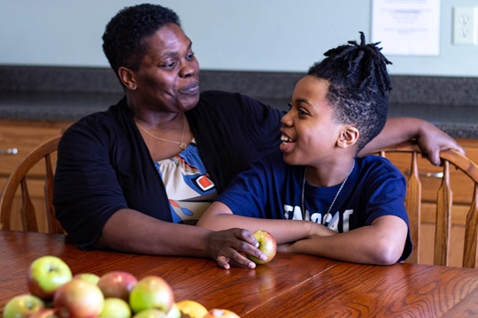 woman and boy at table in Hope Ministries