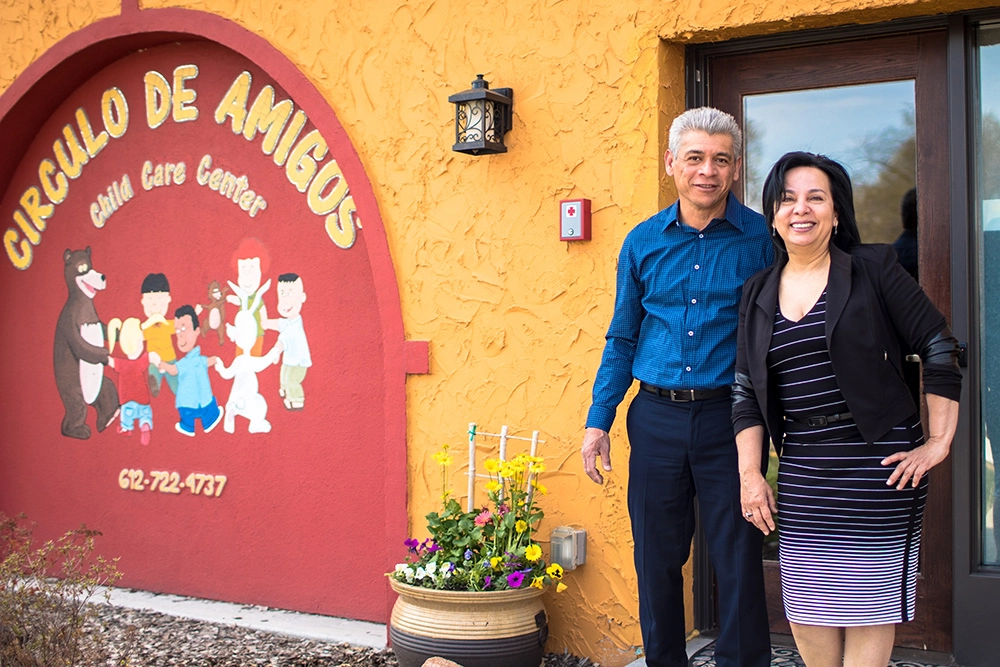 man and woman standing in front of Circulo De Amigos