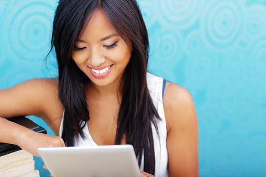 woman smiling while looking down