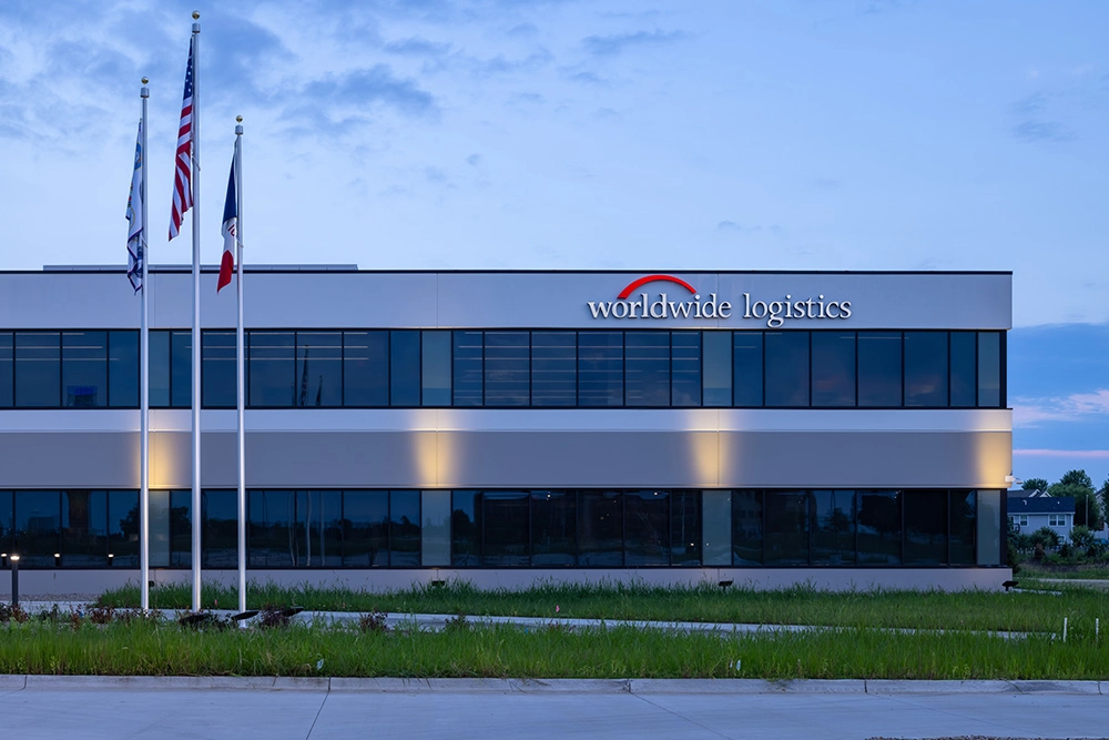 Exterior of office building with "WorldWide Logistics Headquarters" sign