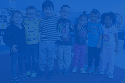 A group of smiling young children with a blue overlay over top.